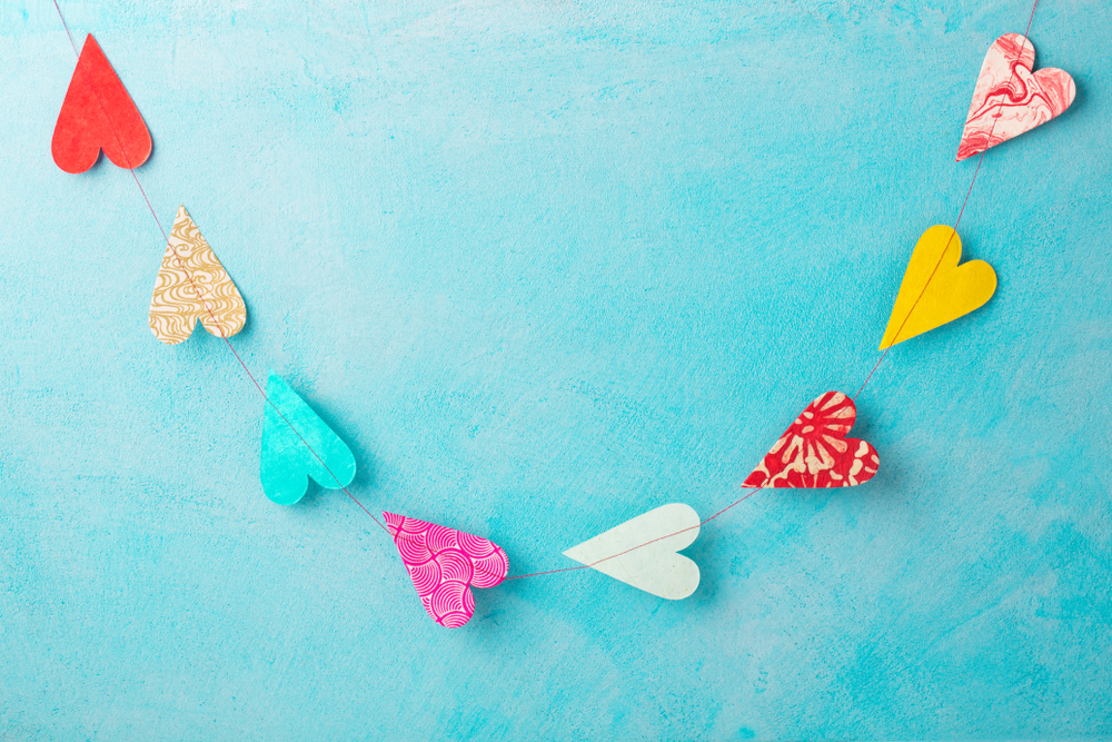 Nothing celebrates love like a new little baby so why not throw a Valentine's baby shower? These Valentine's baby shower ideas are amazing! Heart garlands are the perfect touch.